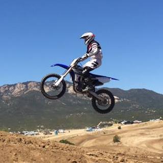 Yamaha YZ motocross jump with mountain backdrop